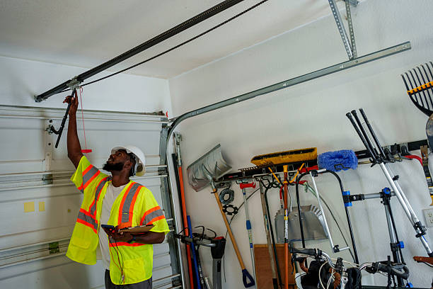 Professional Garage Door Panel Replacement technician working in Shelby, MS